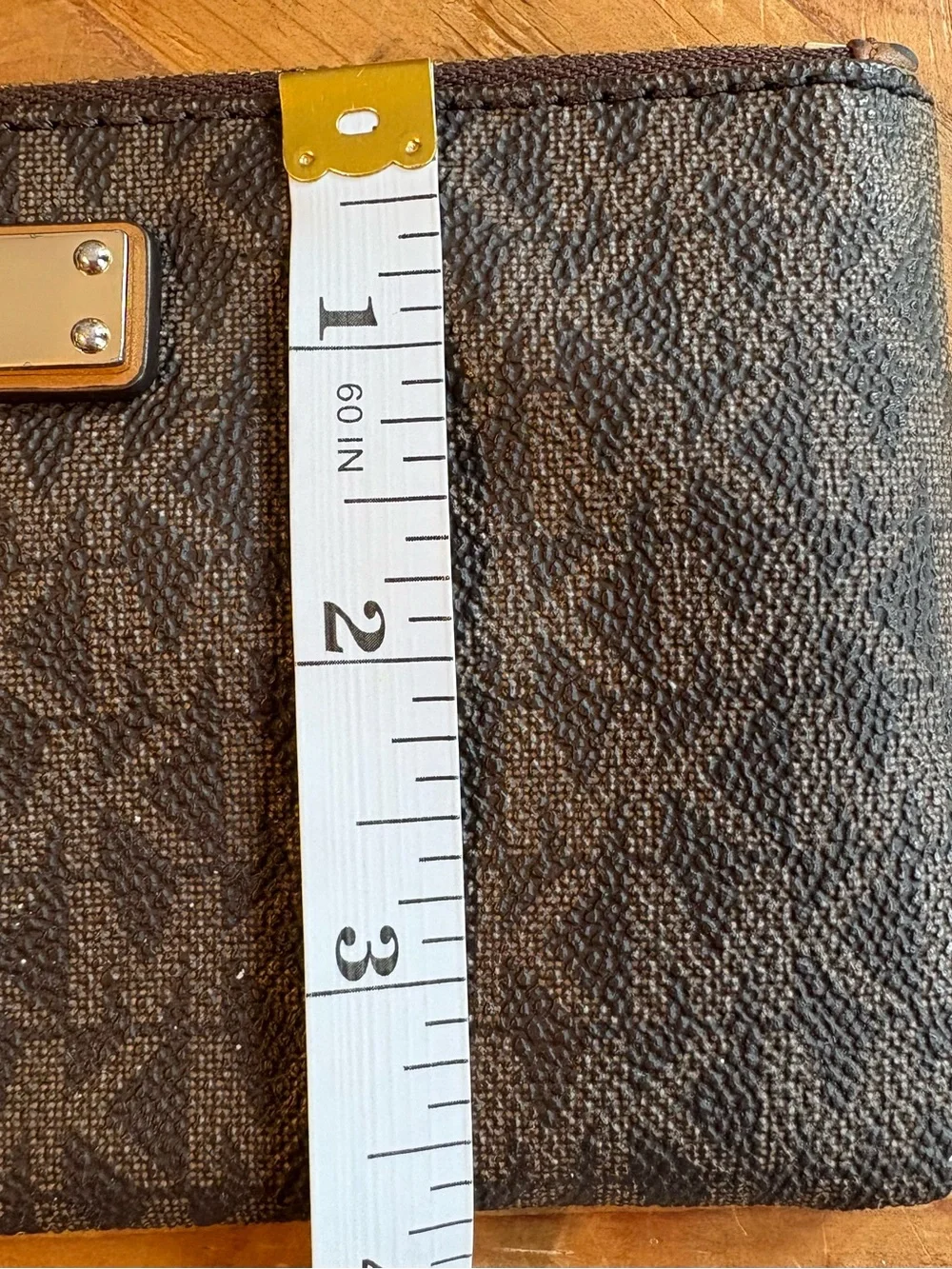 Michael Kors Brown and Tan Signature Wristlet with Gold Plate
